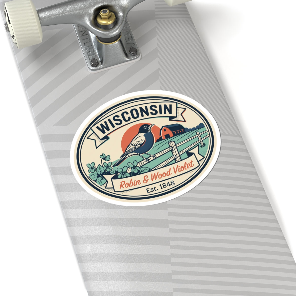 Wisconsin badge sticker on striped metal surface; robin on fence with flowers and “Est. 1848”.