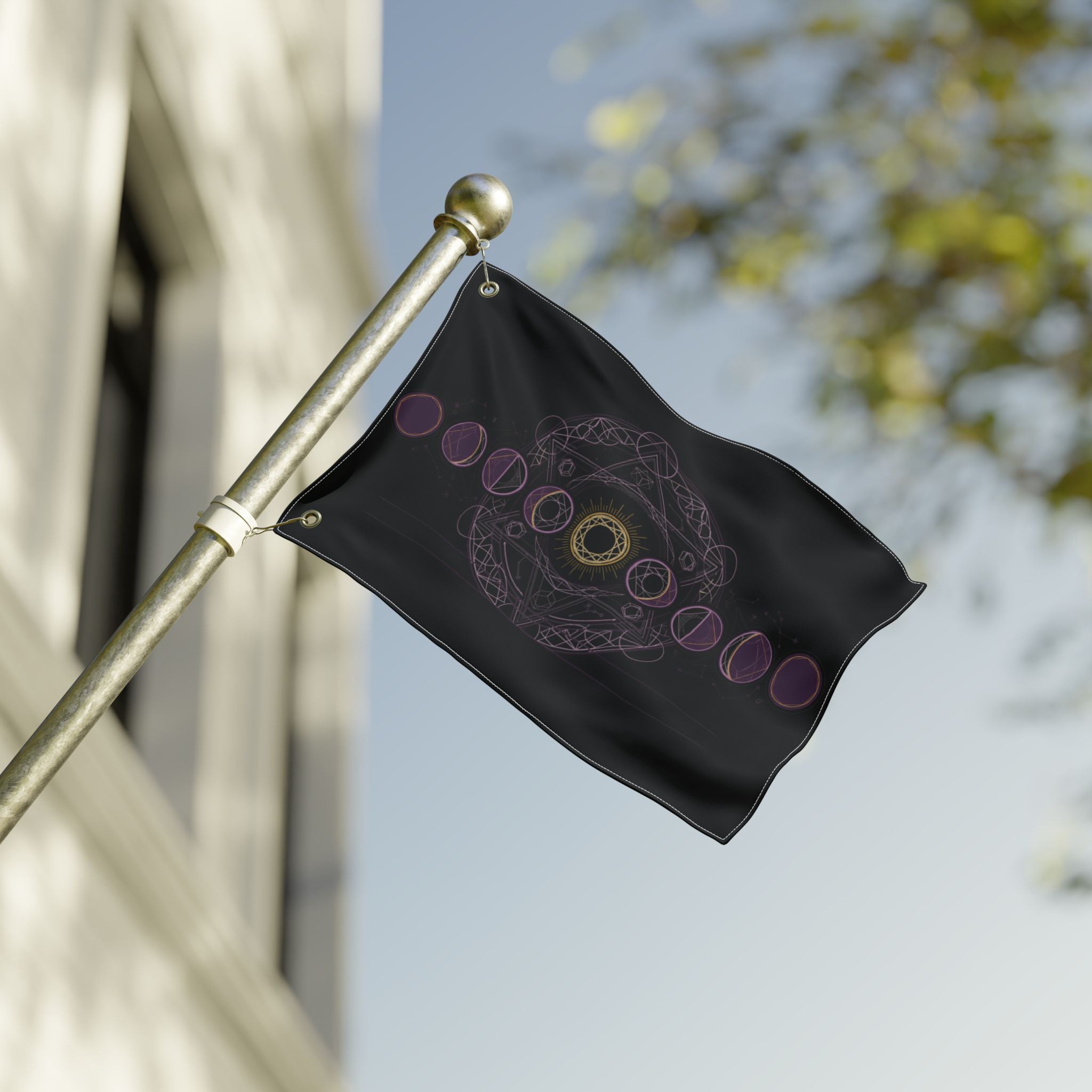 Black moon-phase flag on brass pole, purple ring line and small gold mandala center.
