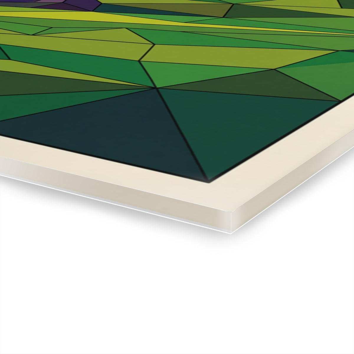 Close-up of acrylic wall art corner showing green and teal geometric facets