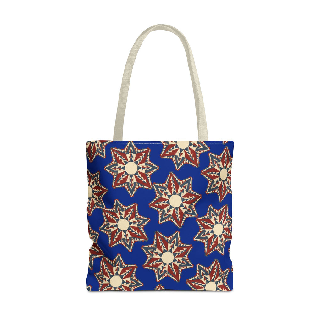 Front-facing blue tote bag with starburst floral mandala pattern and beige handles