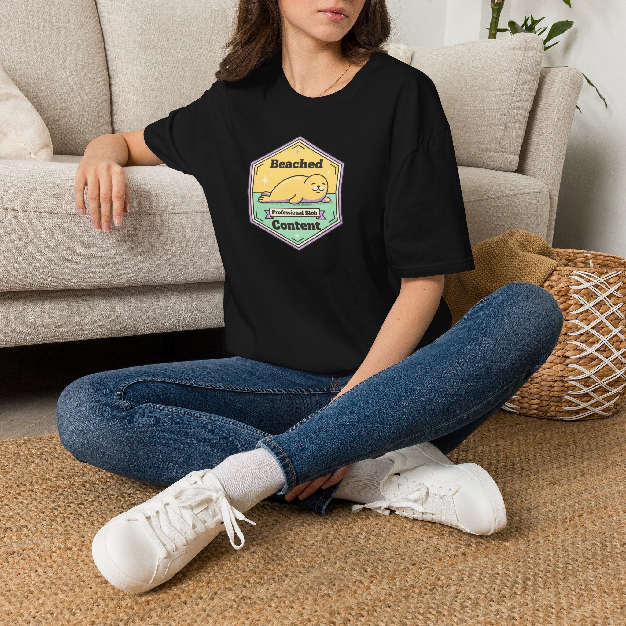 Black T-shirt with seal badge graphic on chest, crew neck, short sleeves