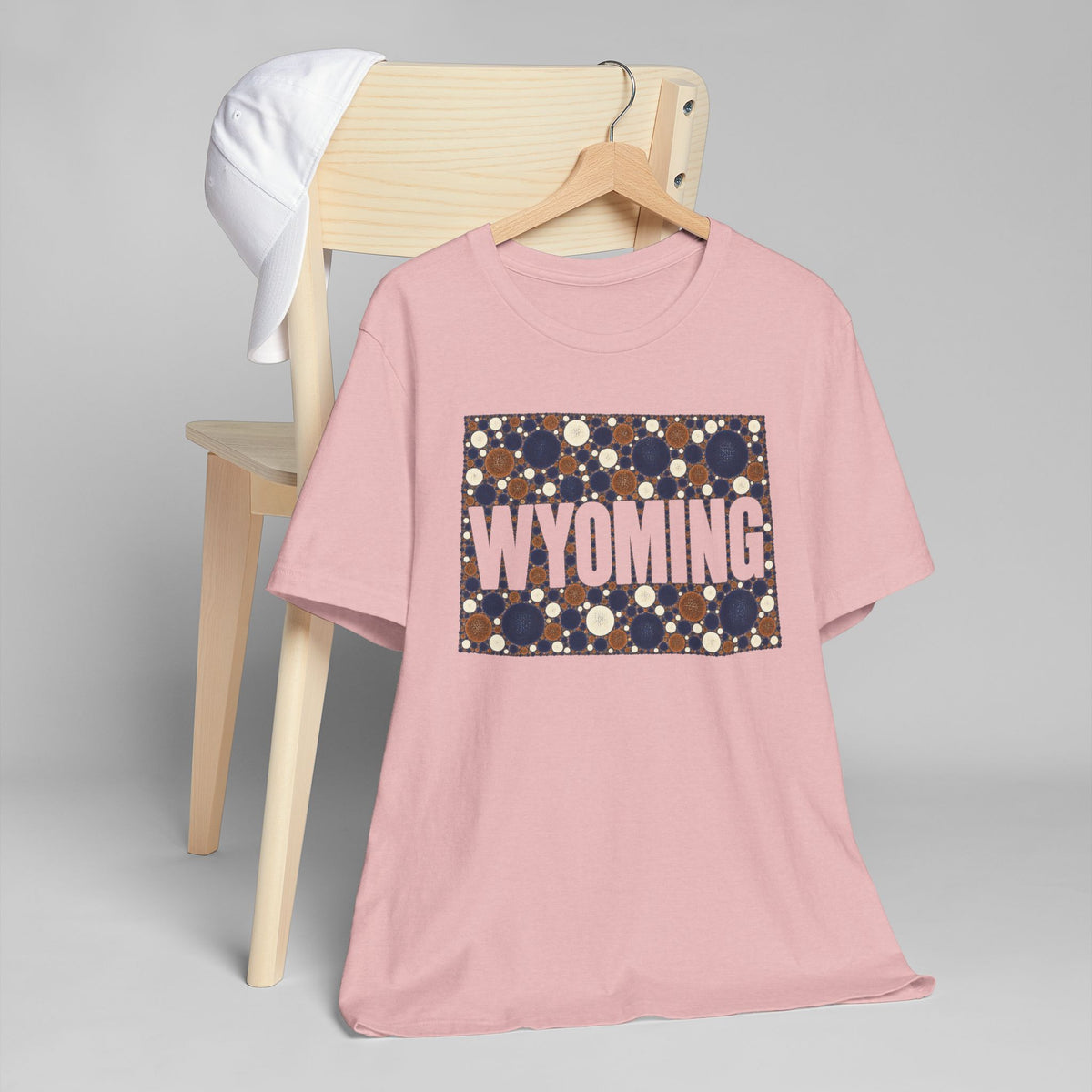 Pink crewneck t-shirt with dotted Wyoming map graphic in navy and brown