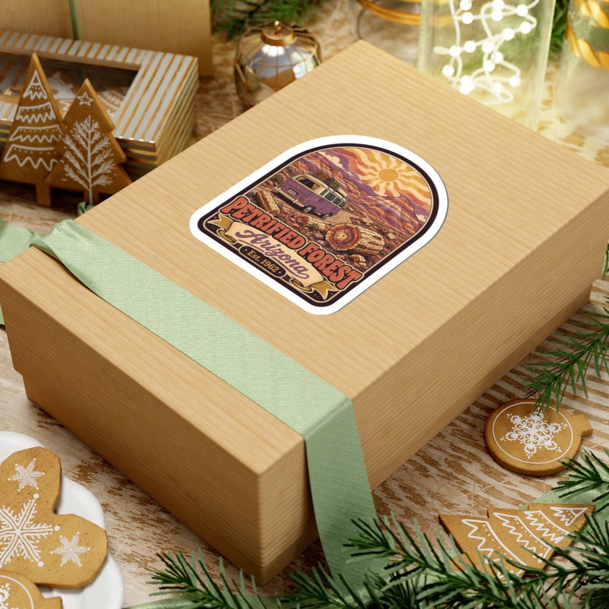 Small desert camper van sticker on gift box top, 'Petrified Forest Arizona Est. 1962' text.