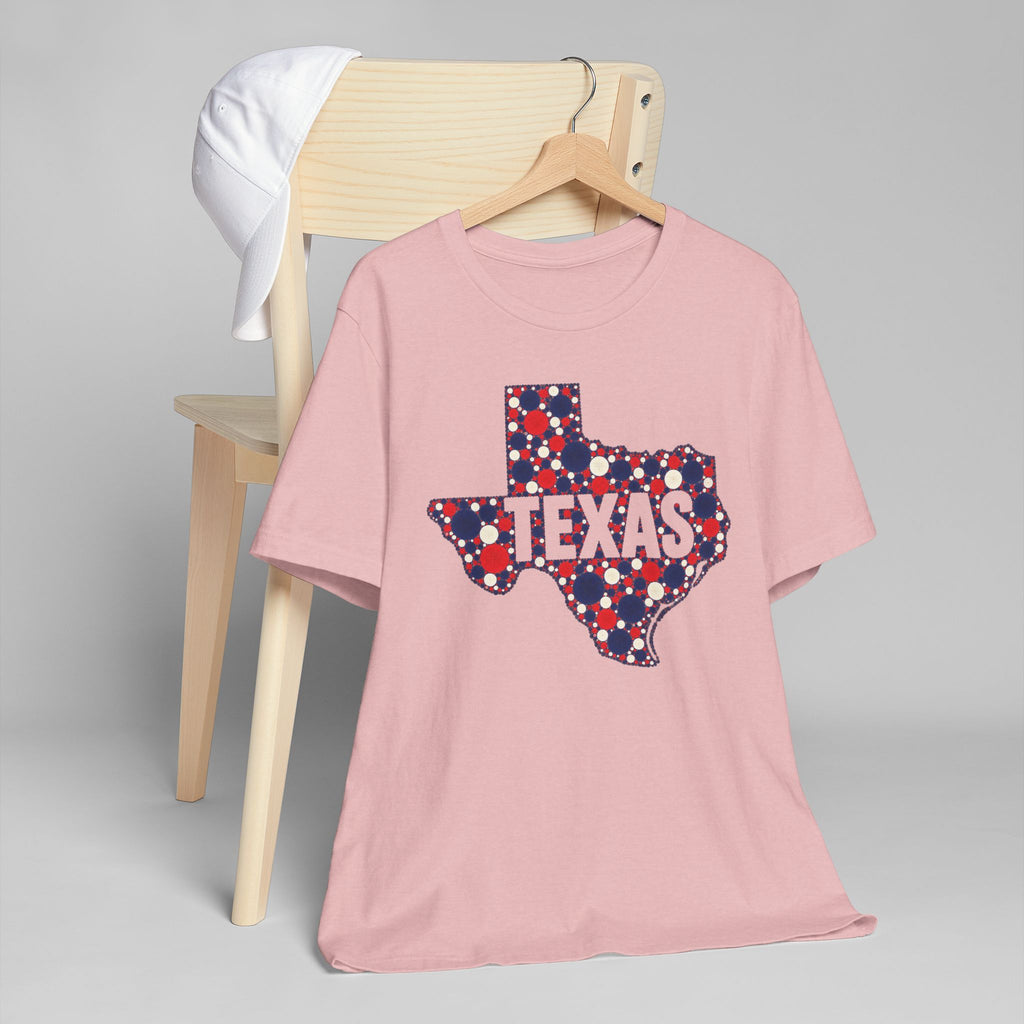 Pink T-shirt with Texas outline logo in red, blue, and white polka dots