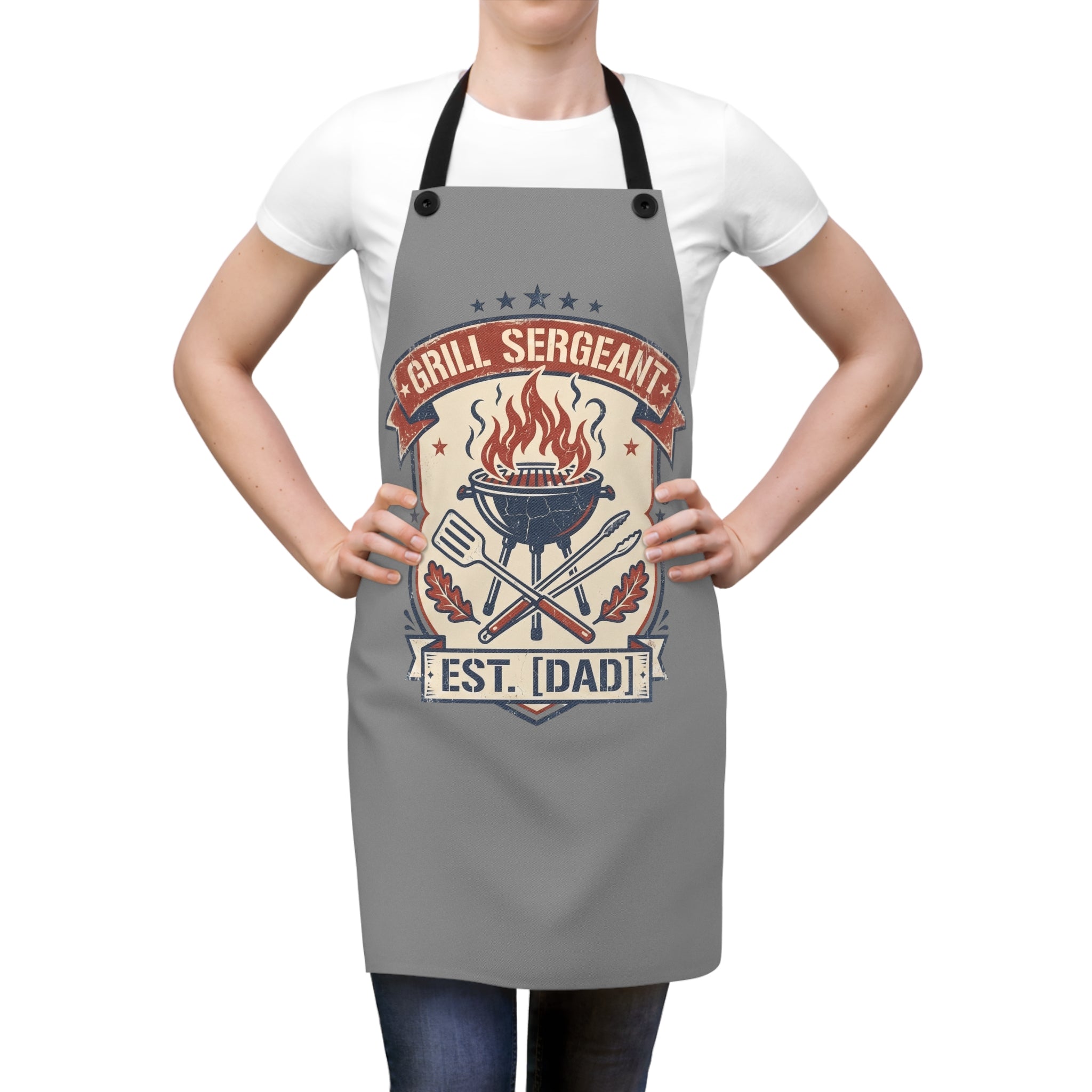 Gray BBQ apron on person with black straps and flame grill retro badge