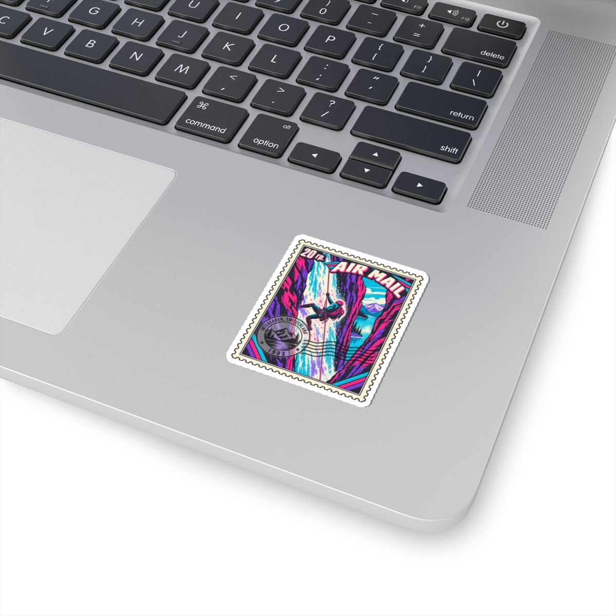 Small neon climber air mail sticker on laptop, square stamp with magenta canyon