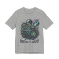 Light gray unisex T-shirt featuring celestial compass and owl graphic, “Orbiting the Absurd”