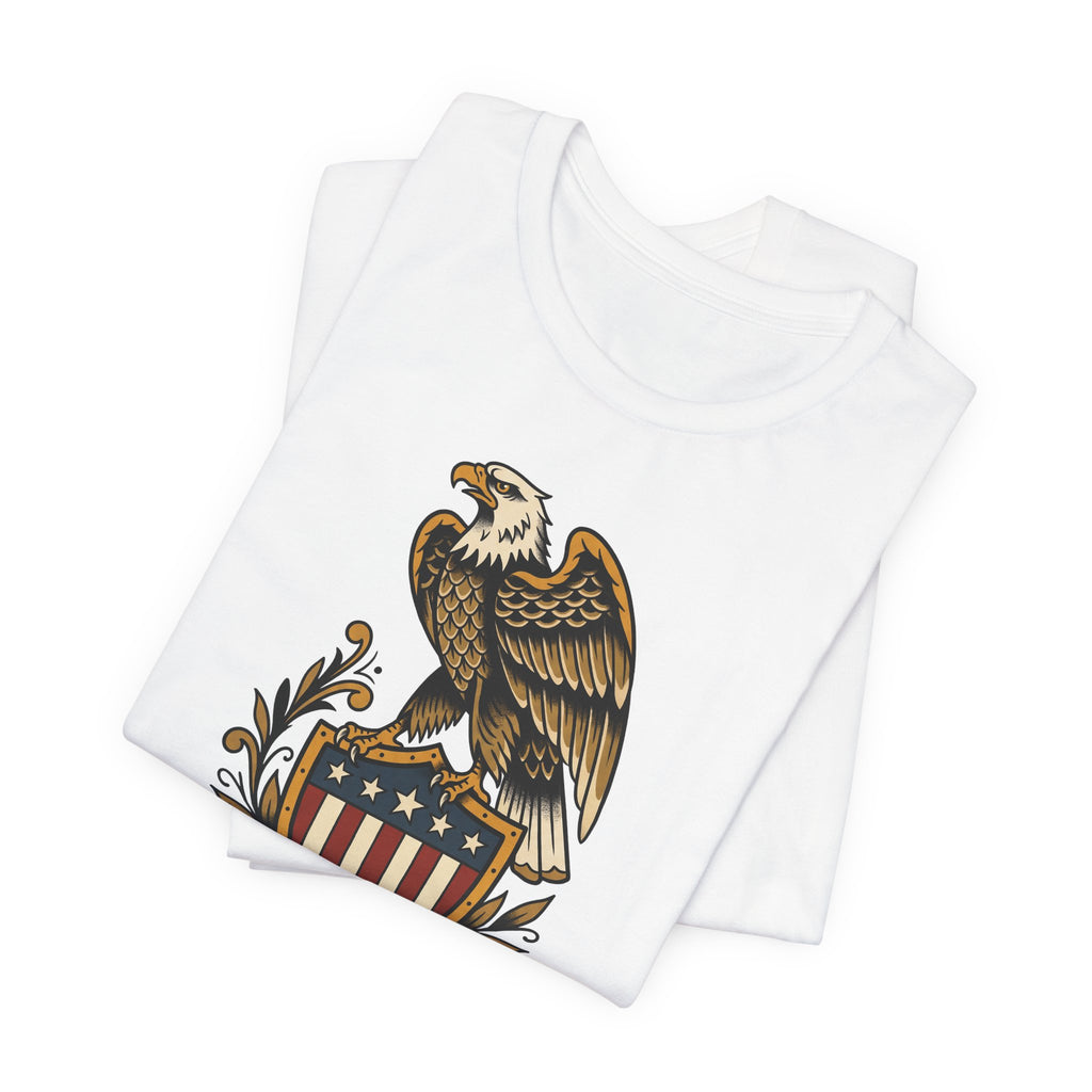 White graphic T-shirt, crew neck; front shows partial eagle and 1776 shield emblem.