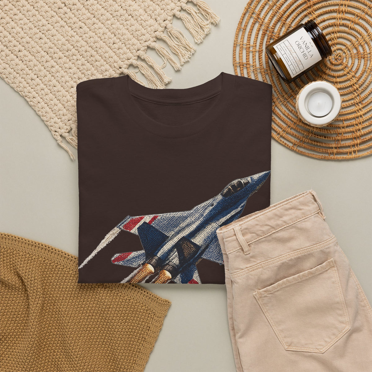 Dark brown crew-neck t-shirt with fighter jet graphic, folded flat