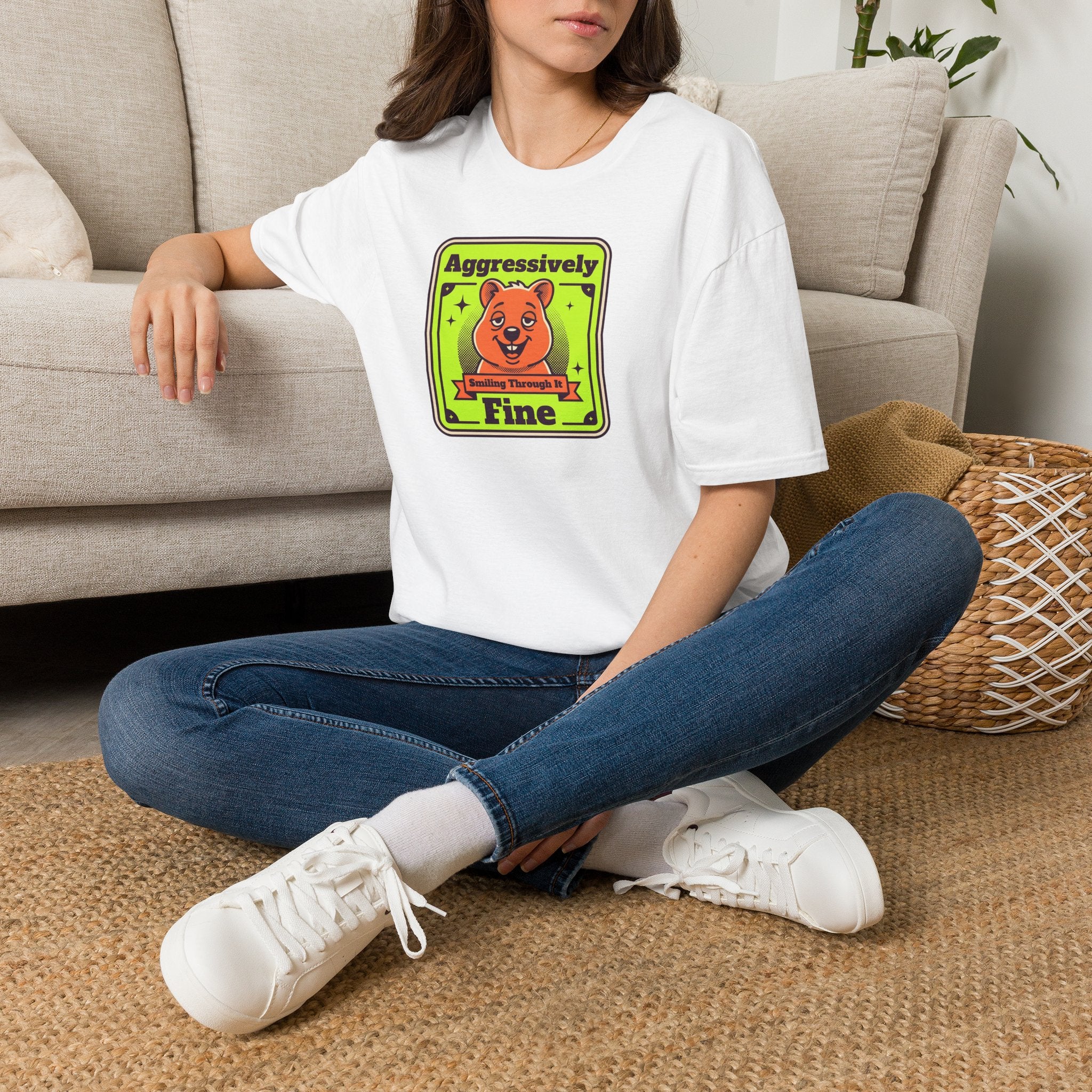 Woman wearing a white T-shirt with neon-style cartoon bear graphic and green-yellow text
