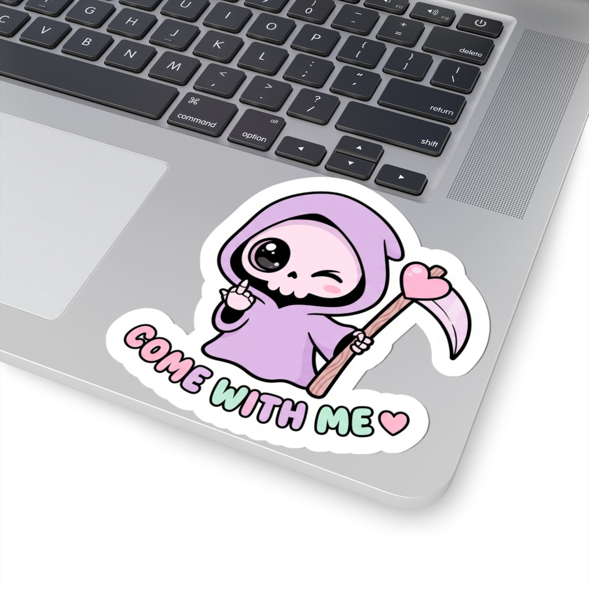 Purple grim reaper sticker on laptop, scythe and heart, text “COME WITH ME”.
