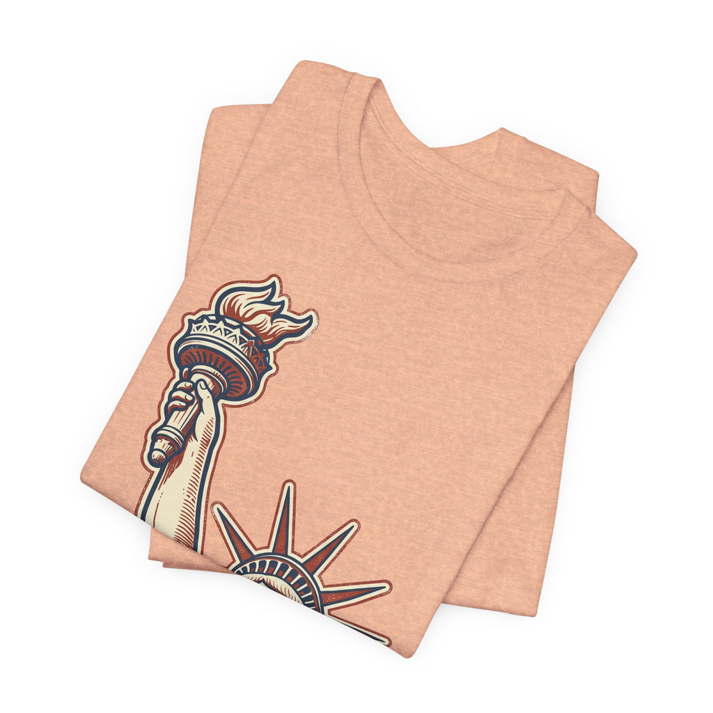 Peach graphic T-shirt showing Statue of Liberty illustration on front