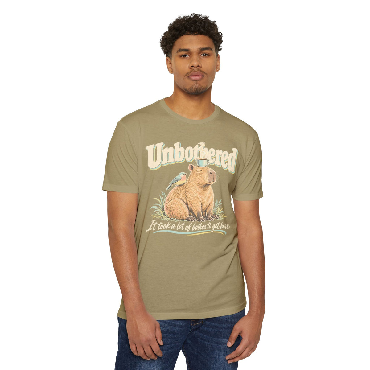 Light olive crewneck t-shirt with capybara graphic and Unbothered text.