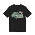 Black T-shirt with green pickup truck and American flag graphic