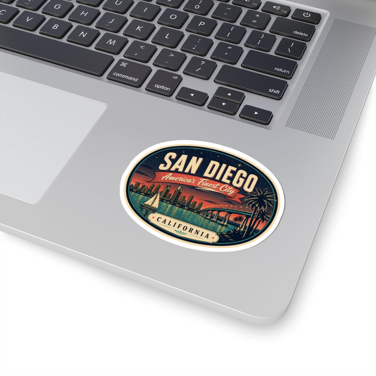 Round San Diego luggage tag sticker on a laptop, with “America’s Finest City” text