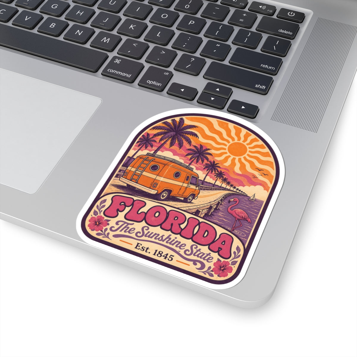 Rounded Florida souvenir sticker featuring orange van, palms, flamingo, sun and “Florida” lettering