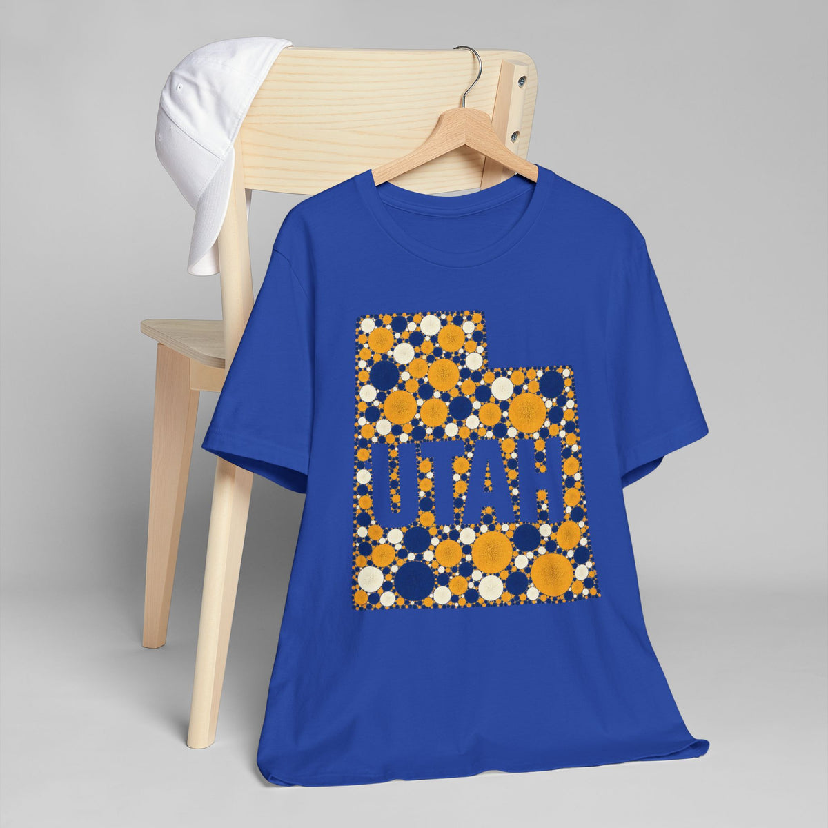 Royal blue T-shirt with large polka-dot state graphic print.