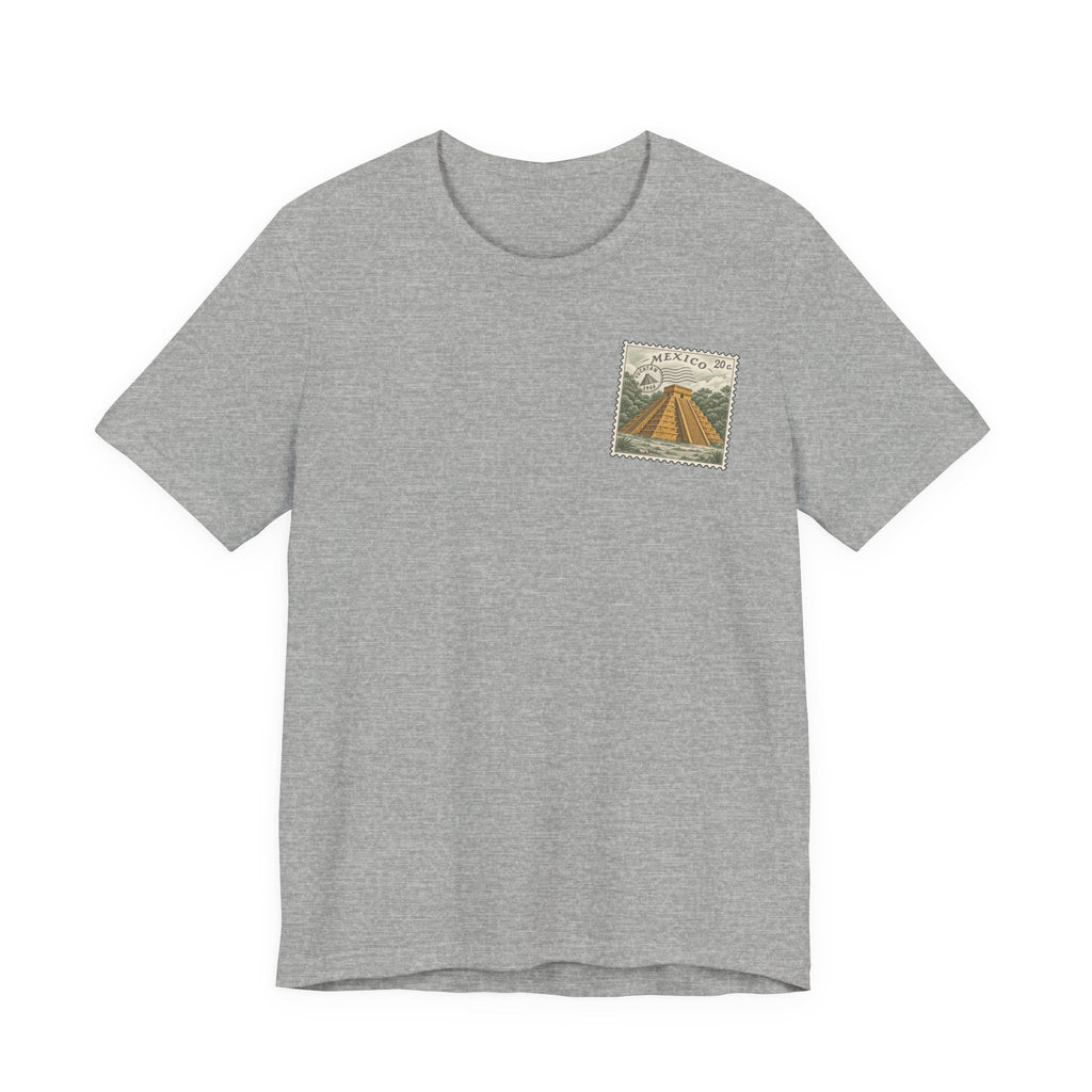 Light gray t-shirt with small vintage-style Mexico stamp graphic at upper chest