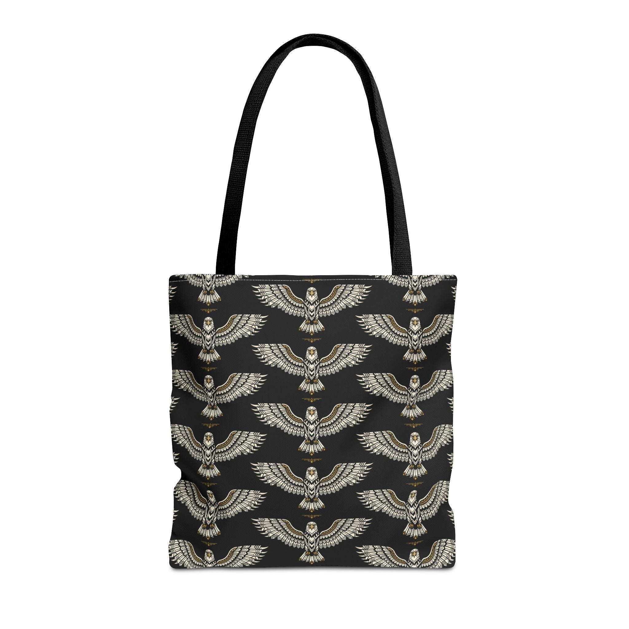 Tote bag with black fabric and repeating gold winged scarab pattern, black handles