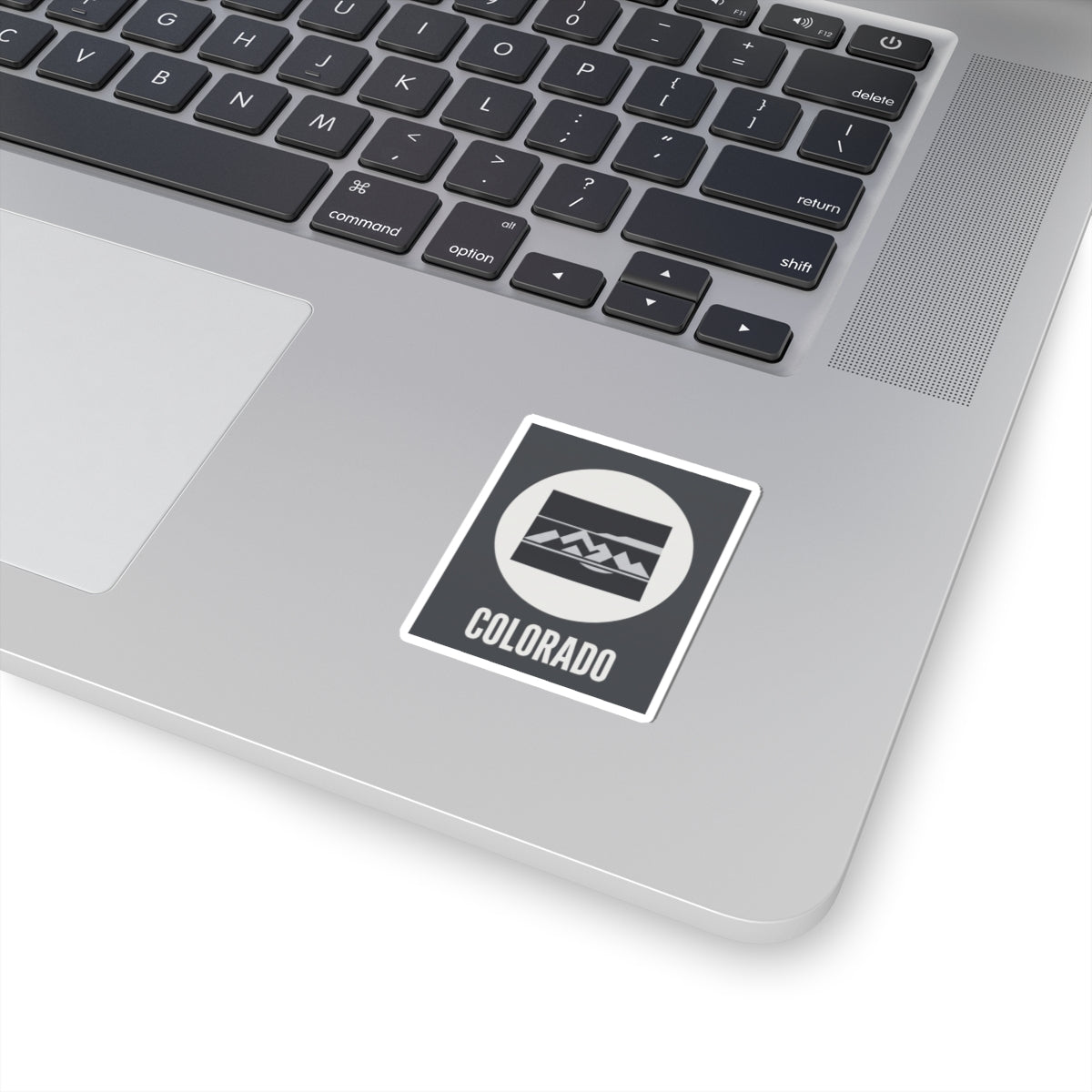 Colorado mountain badge sticker with black mountain icon and COLORADO text, white outline