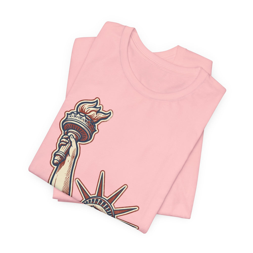 Light pink graphic tee stack with Liberty Statue illustration on front