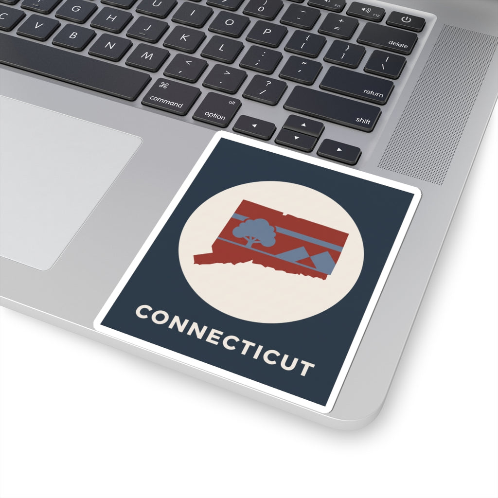 Connecticut state map sticker on laptop lid, white-bordered circle with map icon