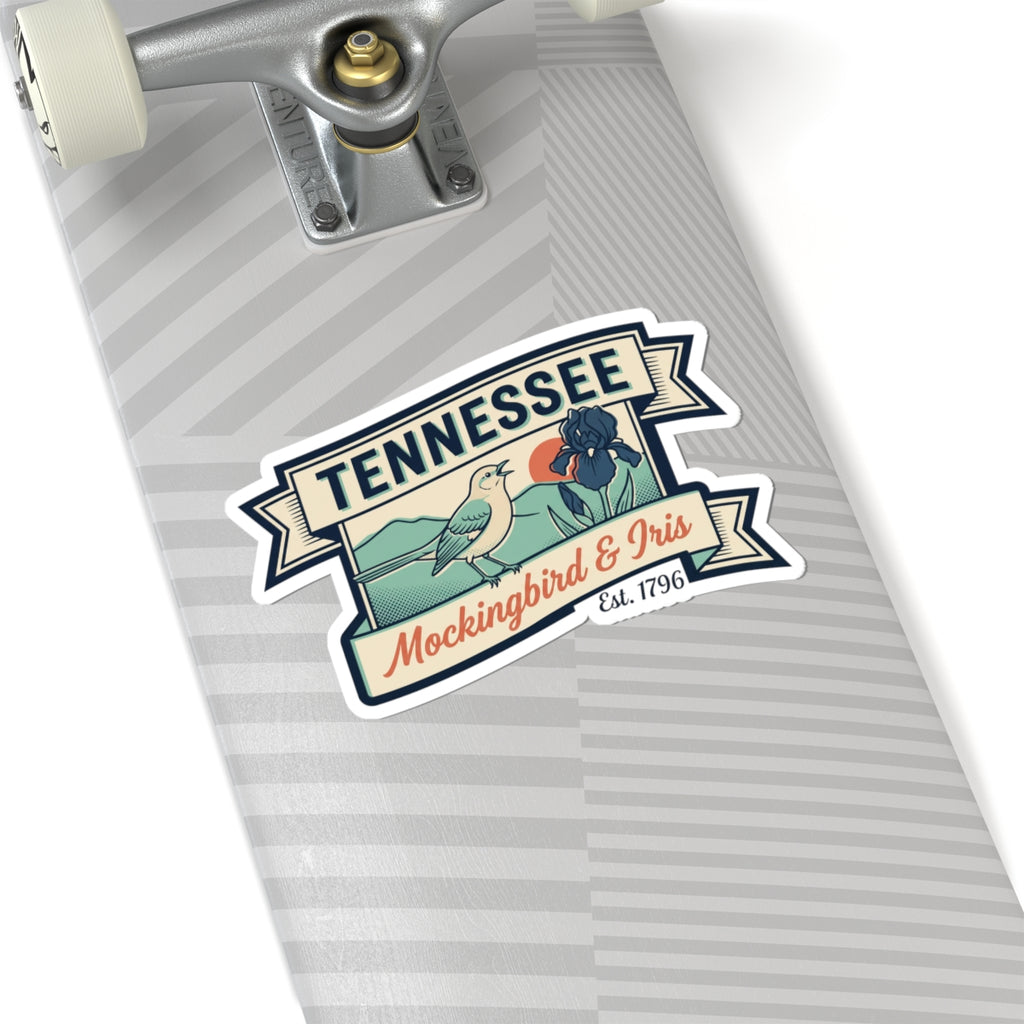 Tennessee vinyl sticker on a skateboard deck, with mockingbird and iris crest