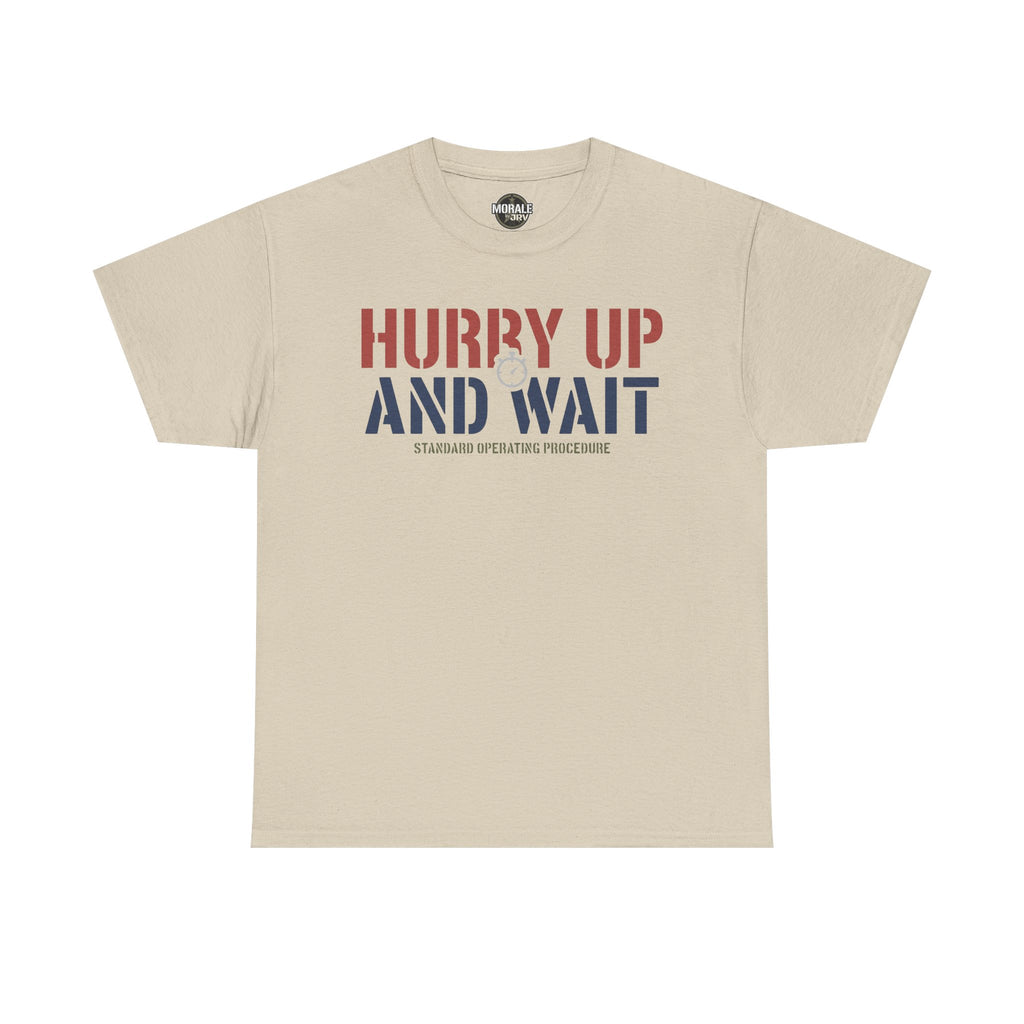 Sand T-shirt with 'HURRY UP AND WAIT' graphic and 'STANDARD OPERATING PROCEDURE' text