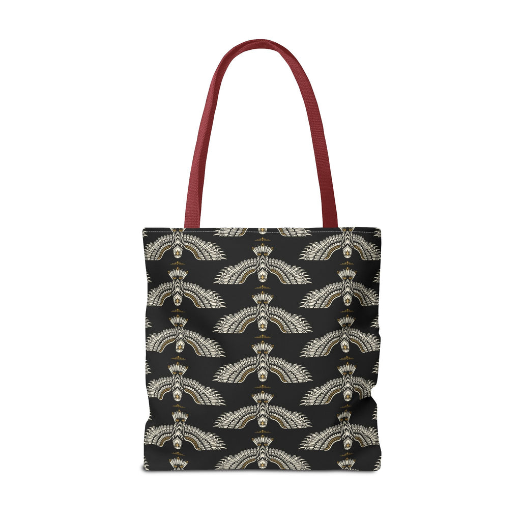 Tote bag front view on black base with repeating winged scarab motif, maroon handles