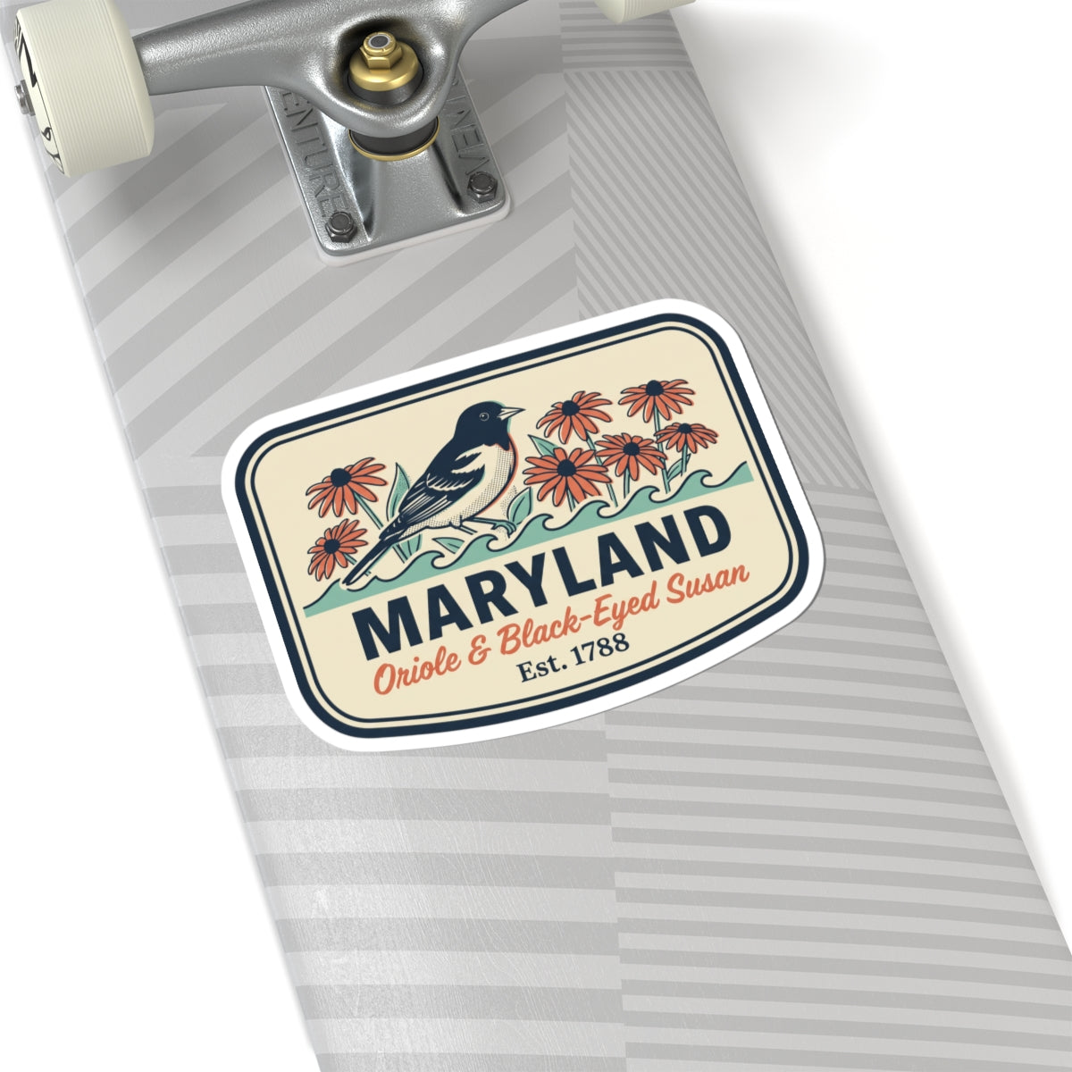 Maryland sticker on a light gray surface, rounded badge with blue bird and red flowers
