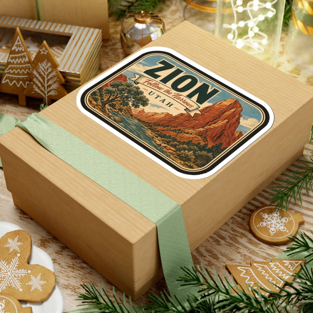 Zion National Park sticker on gift box, rounded design with canyon cliffs and ZION lettering