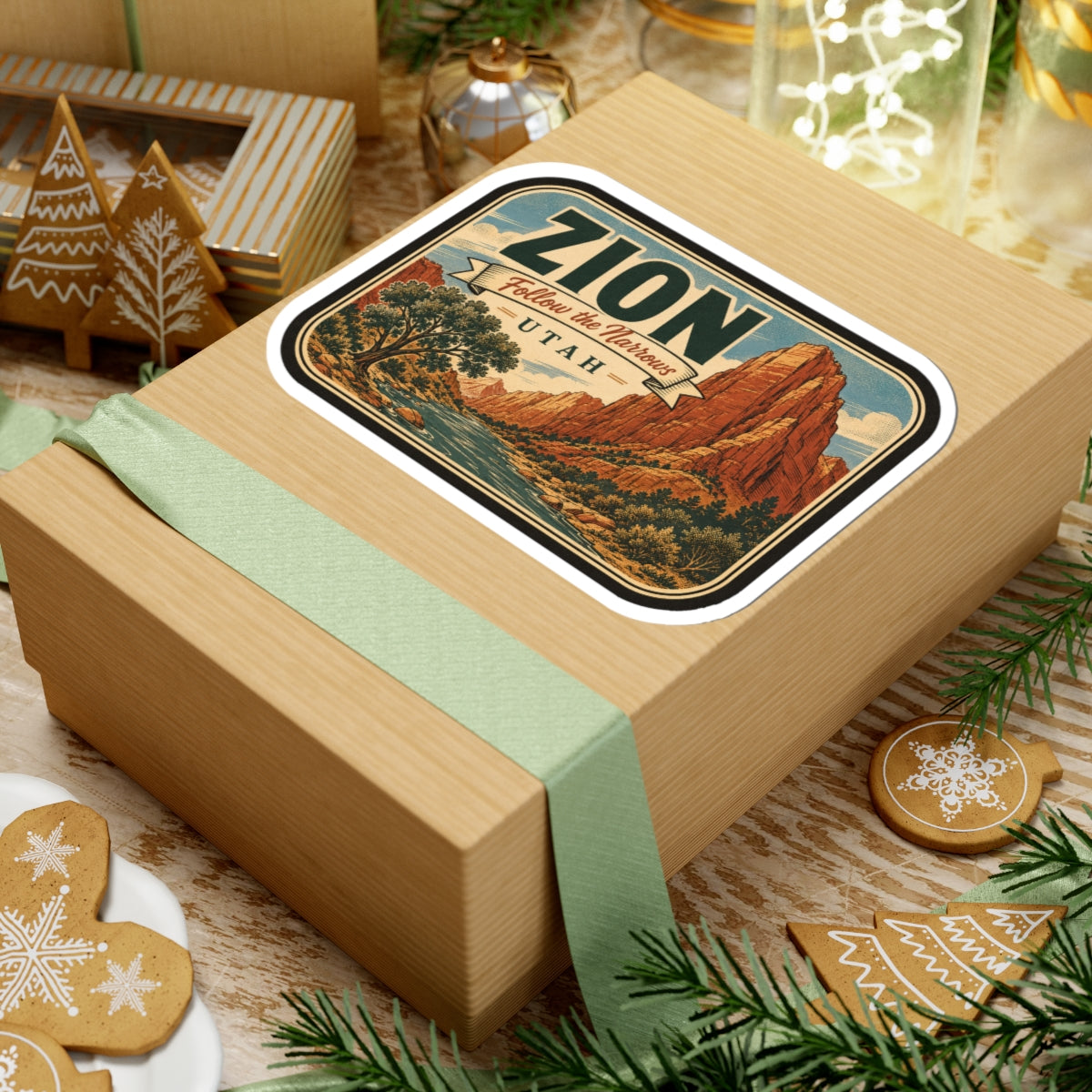Zion National Park sticker on gift box, rounded design with canyon cliffs and ZION lettering