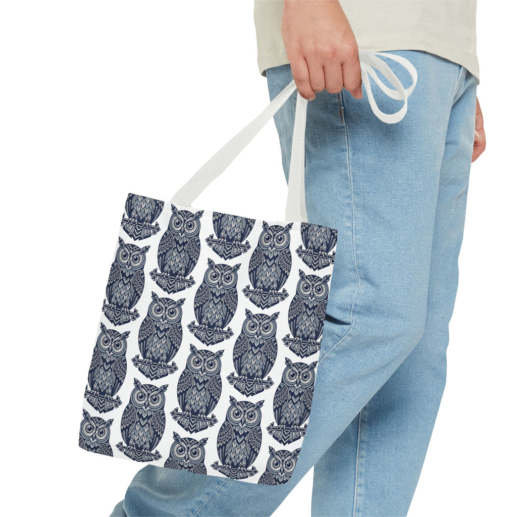Owl print tote bag with light handles, repeating blue and white owl illustrations.