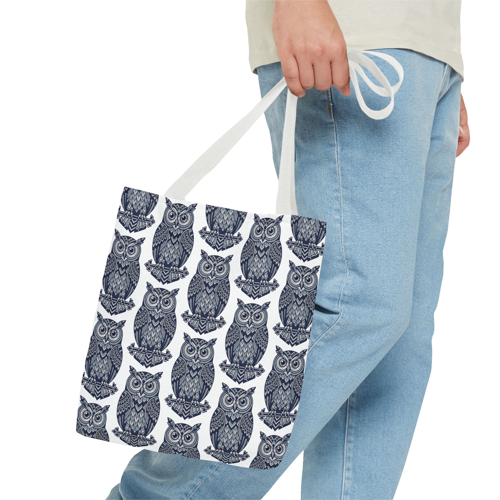 Owl print tote bag with light handles, repeating blue and white owl illustrations.