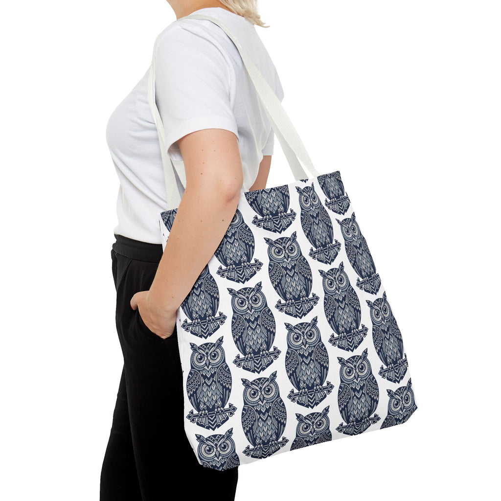 Tote bag with navy owl pattern and white handles, side view