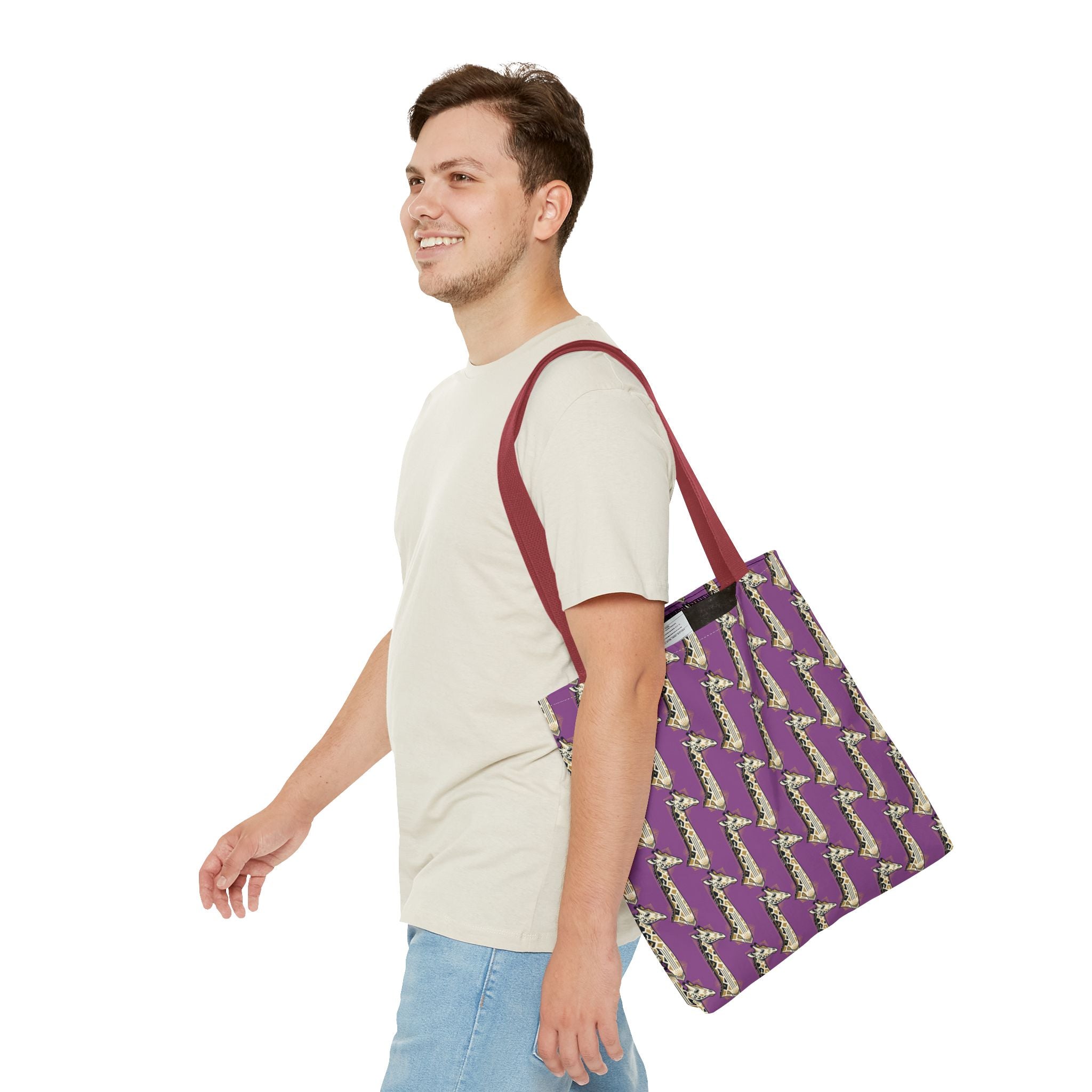 Purple tote bag with saxophone pattern, red shoulder straps on person.