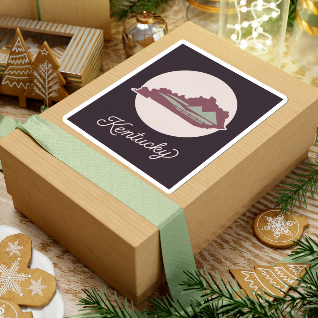 Kentucky silhouette vinyl sticker with white border, mauve Kentucky map, and cursive Kentucky script