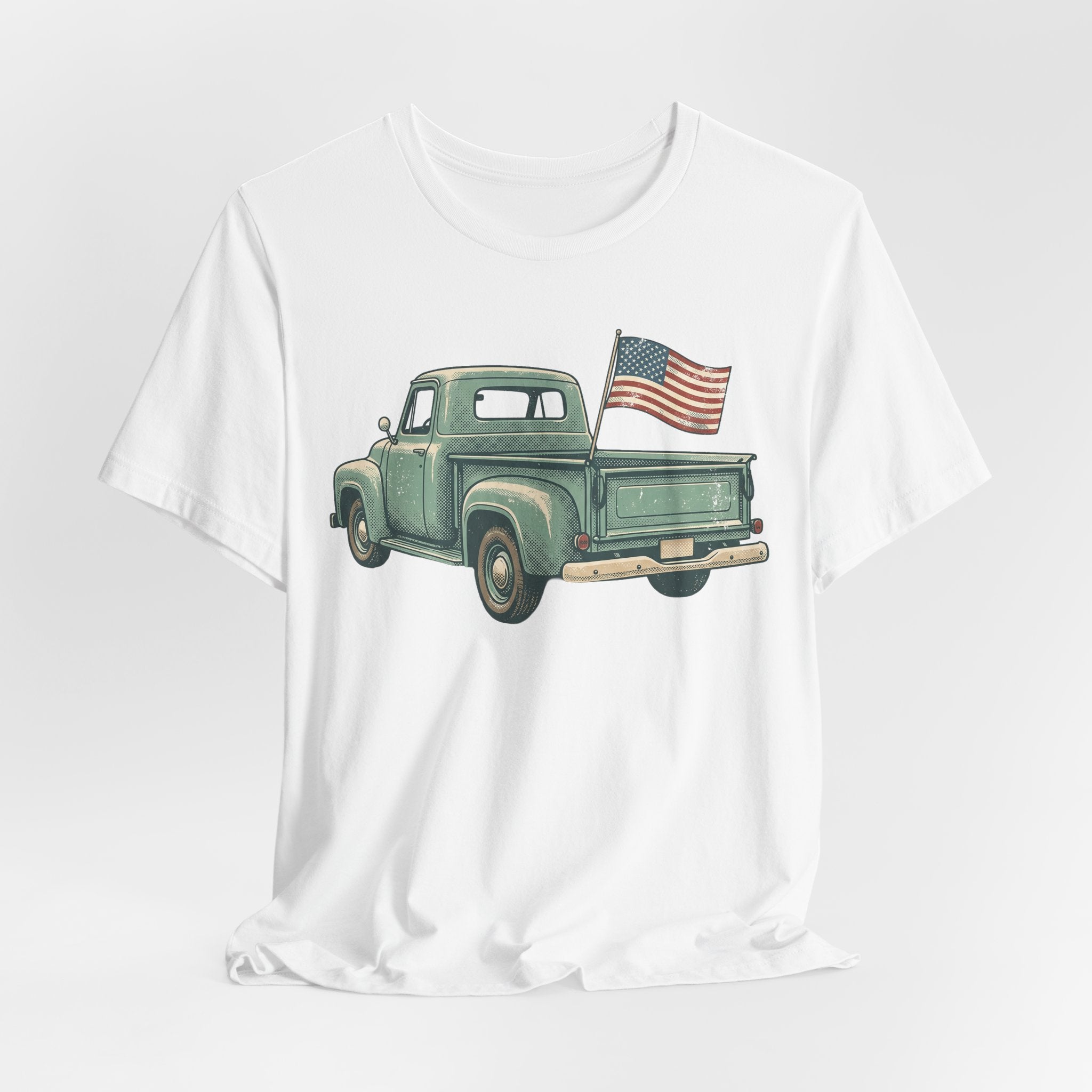 White crew-neck T-shirt with green pickup truck and American flag graphic