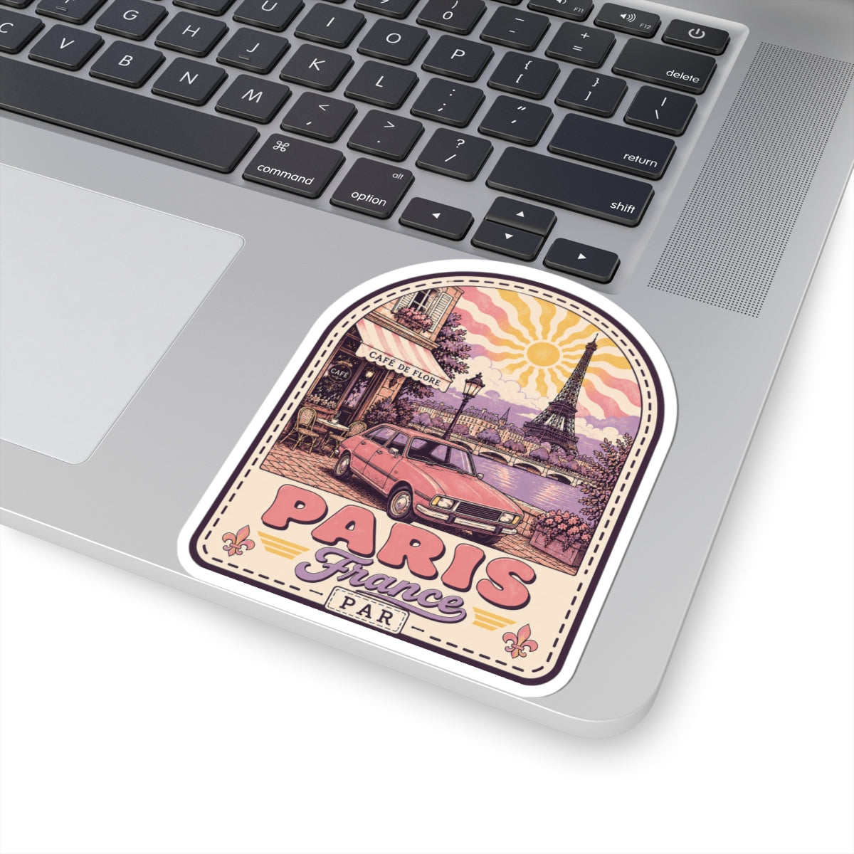 Paris scenic die-cut sticker on laptop keyboard, Eiffel Tower scene and PARIS France text