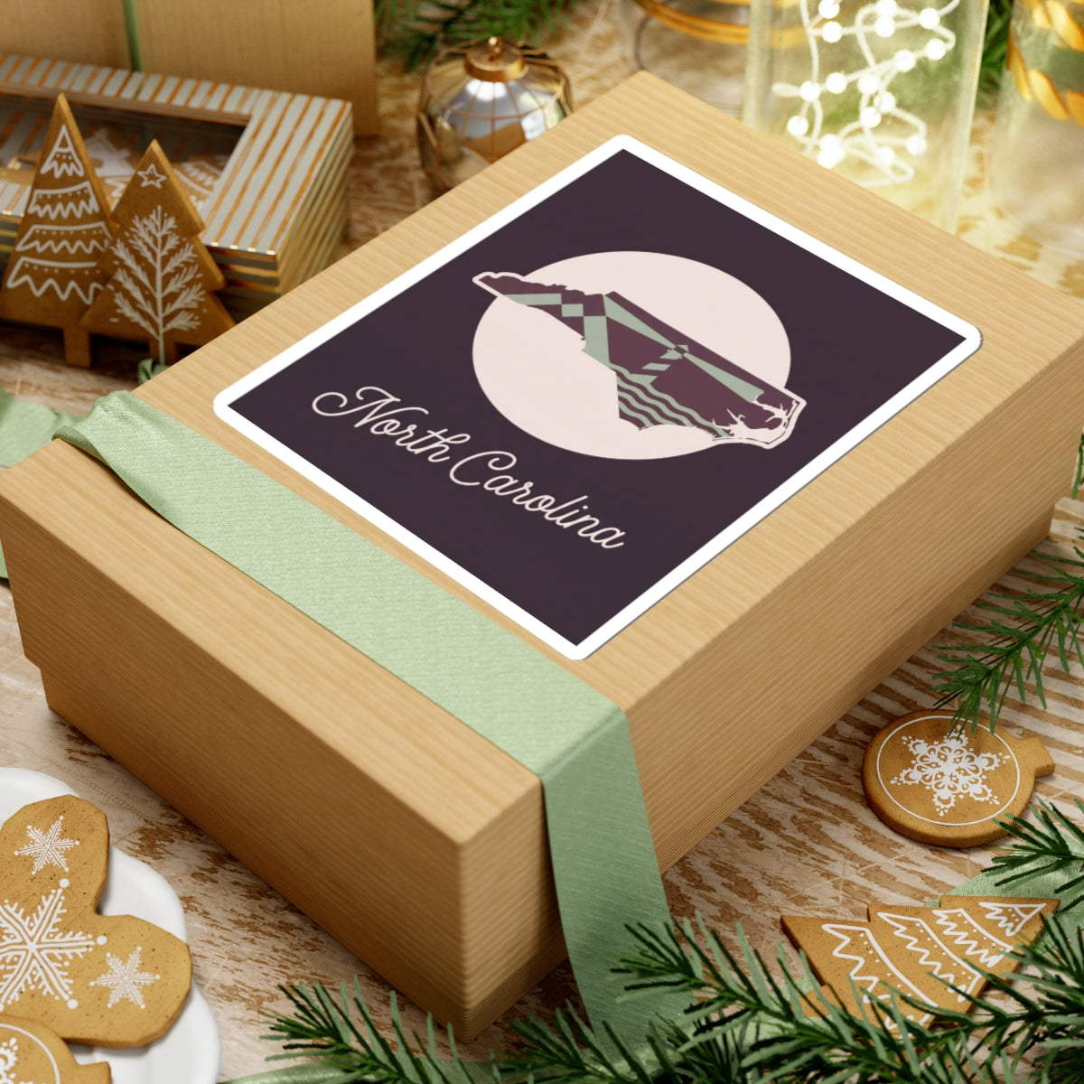 North Carolina decal sticker on gift box lid, purple state silhouette and “North Carolina”