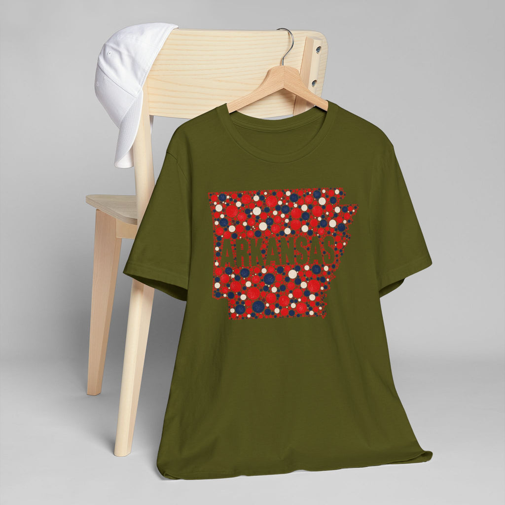 Olive green crew-neck T-shirt with red, white, and blue Arkansas floral dot graphic.