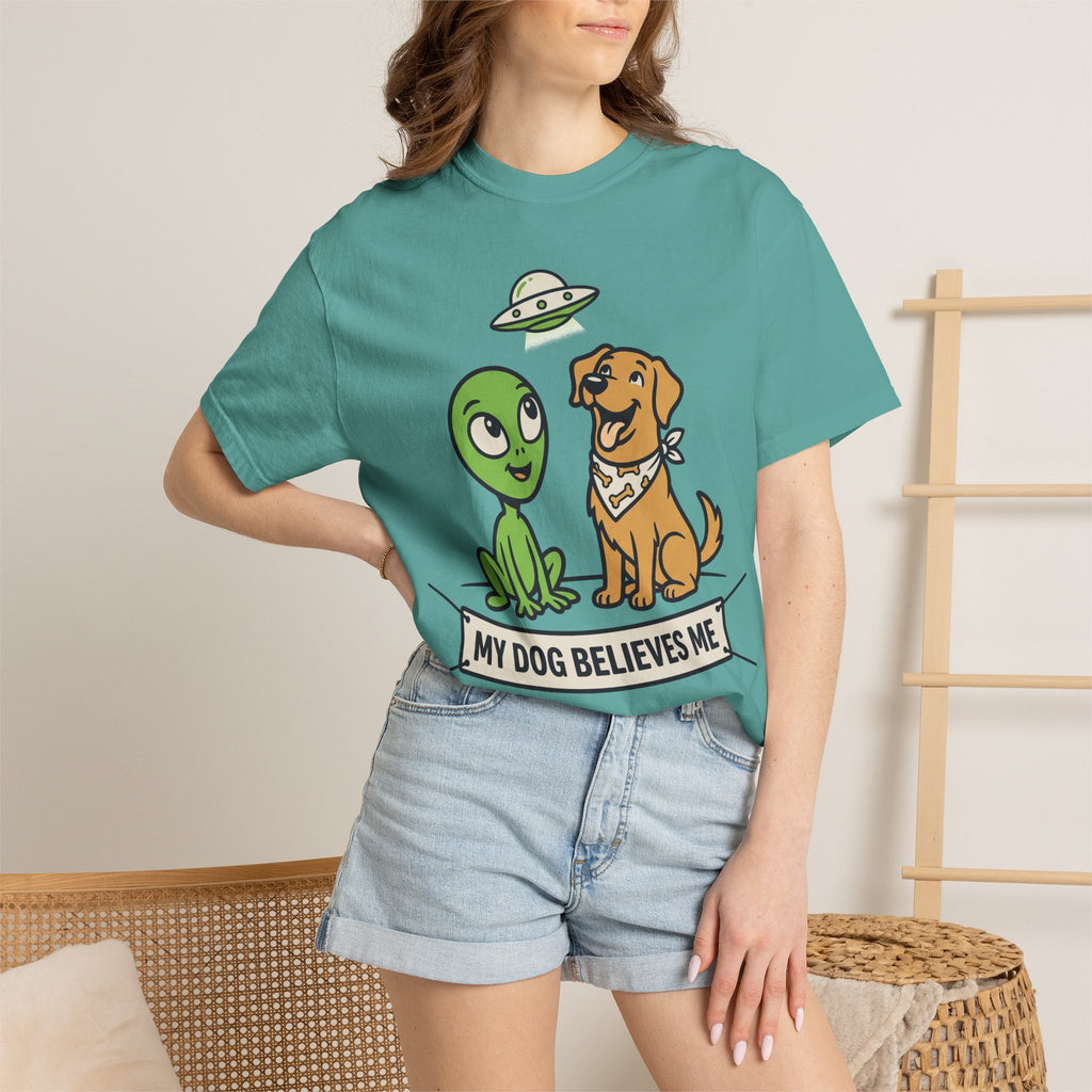 Teal T-shirt on model with alien and dog graphic and slogan