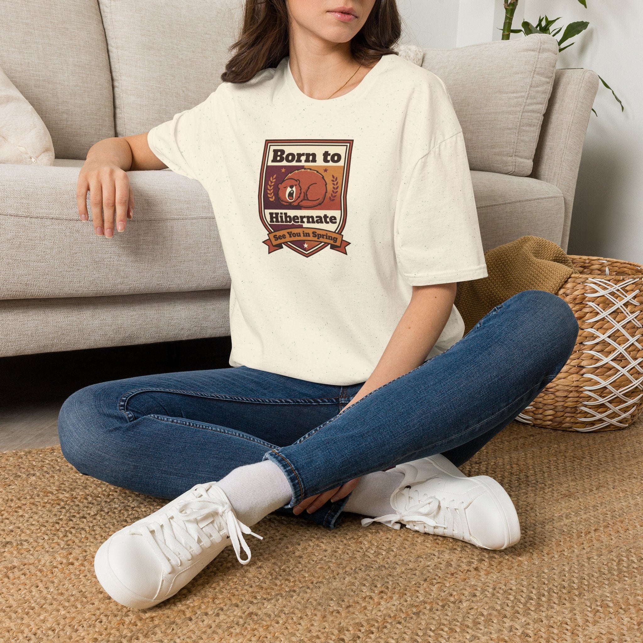 Cream crewneck T-shirt with Born to Hibernate bear badge graphic