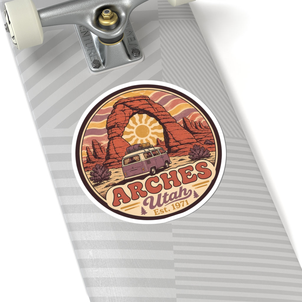 Round sticker depicting red rock arch, camper van, and "ARCHES Utah Est. 1971"