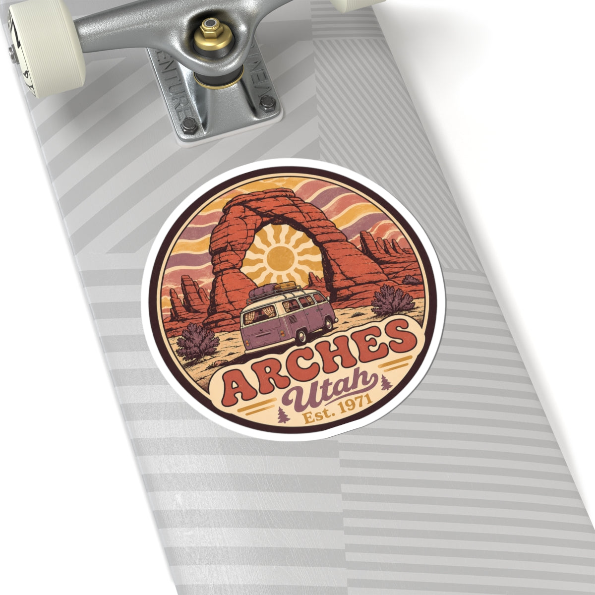 Round sticker depicting red rock arch, camper van, and "ARCHES Utah Est. 1971"