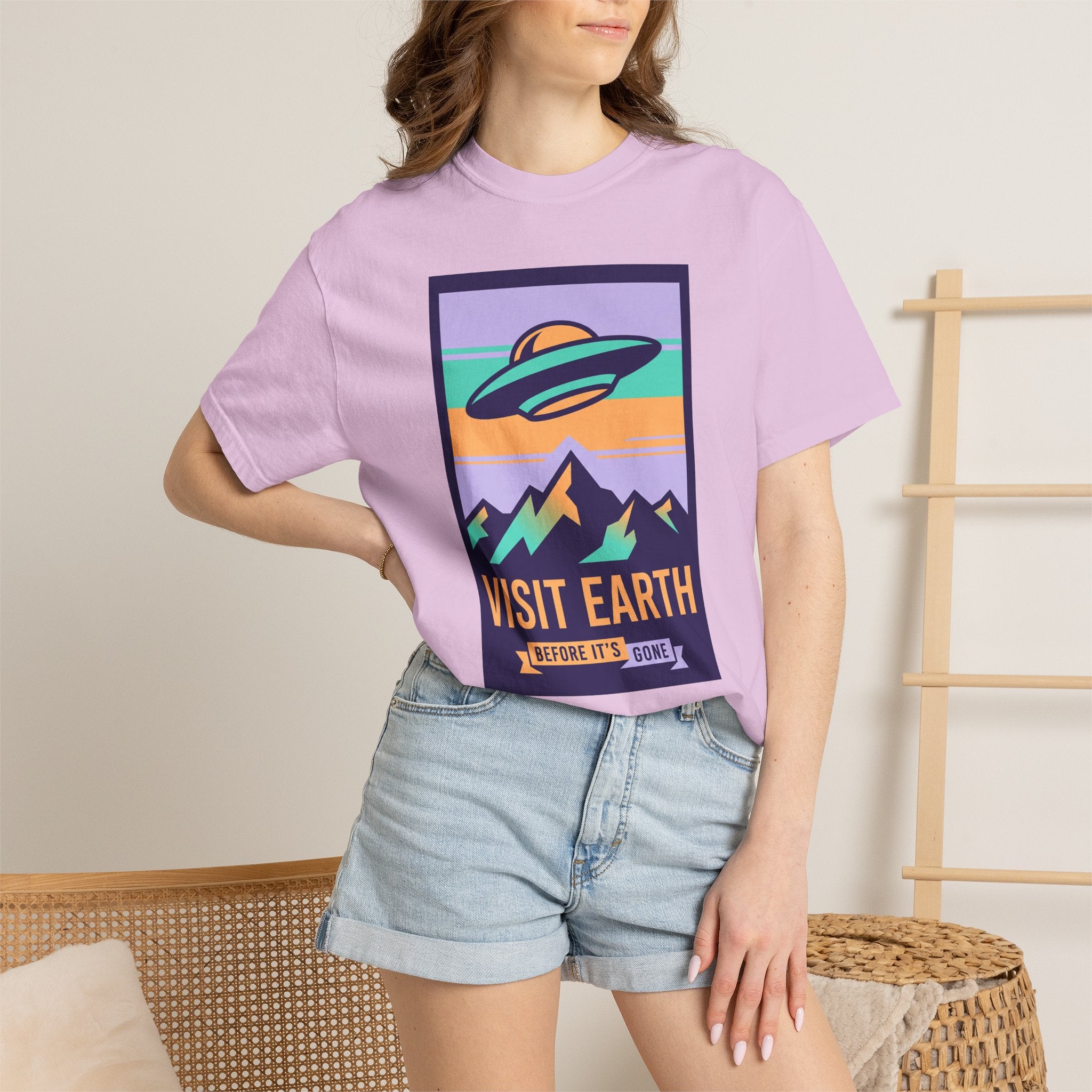 Lilac T-shirt with UFO “VISIT EARTH” front graphic on a model