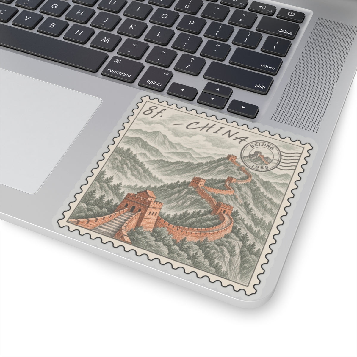 Great Wall of China vintage postage stamp kiss-cut sticker on laptop, close view