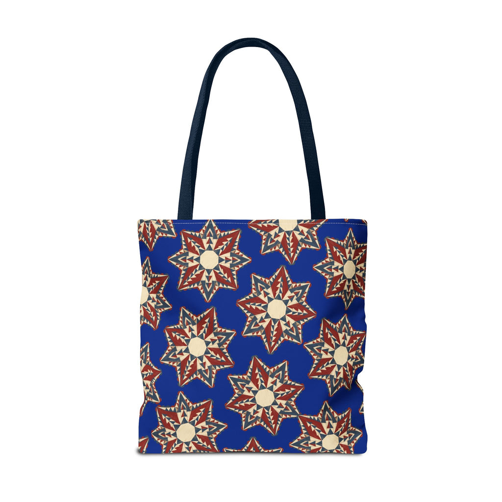 Blue tote bag with red and cream starburst floral pattern, standing front view with handles.