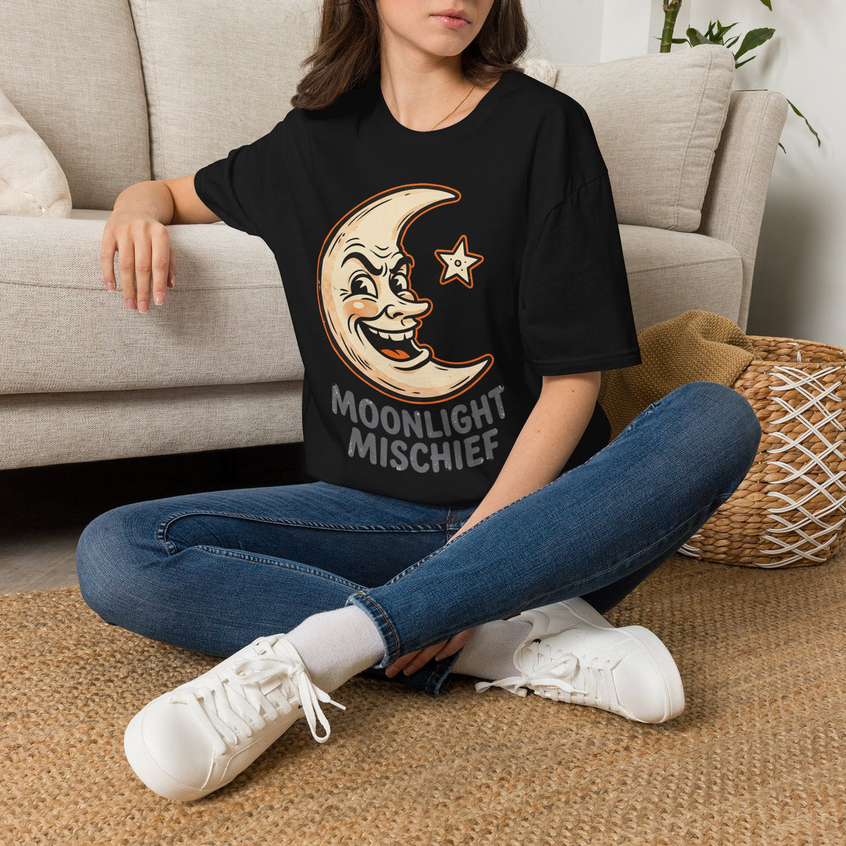 Black T-shirt with cartoon moon face and star graphic, crew neck short sleeves