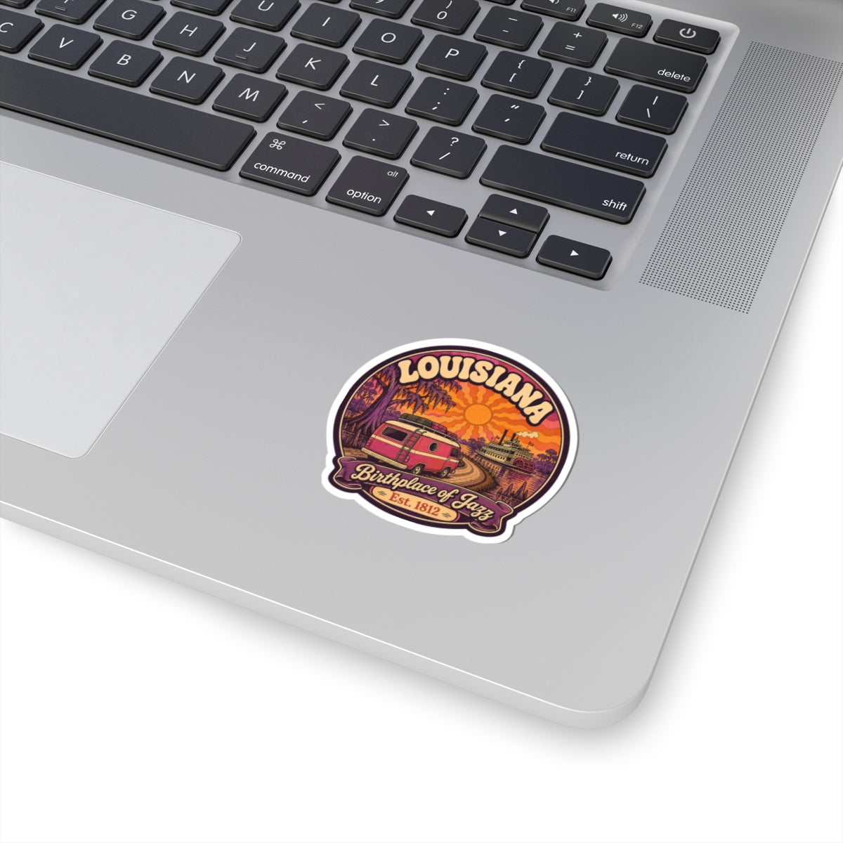 Round kiss-cut sticker with Louisiana Birthplace of Jazz text and vintage red steamboat graphic